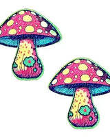 Glittery pink and yellow mushroom pasties, perfect for adding flair to rave outfits and festive occasions.
