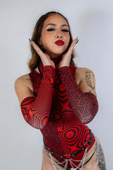 Model showcasing Amplitude Arm Sleeves in red and black, styled for rave outfits, combining fashion and performance.