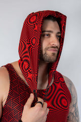 Model wearing the Amplitude Assassin Hood featuring a bold red and black design, perfect for rave outfits.