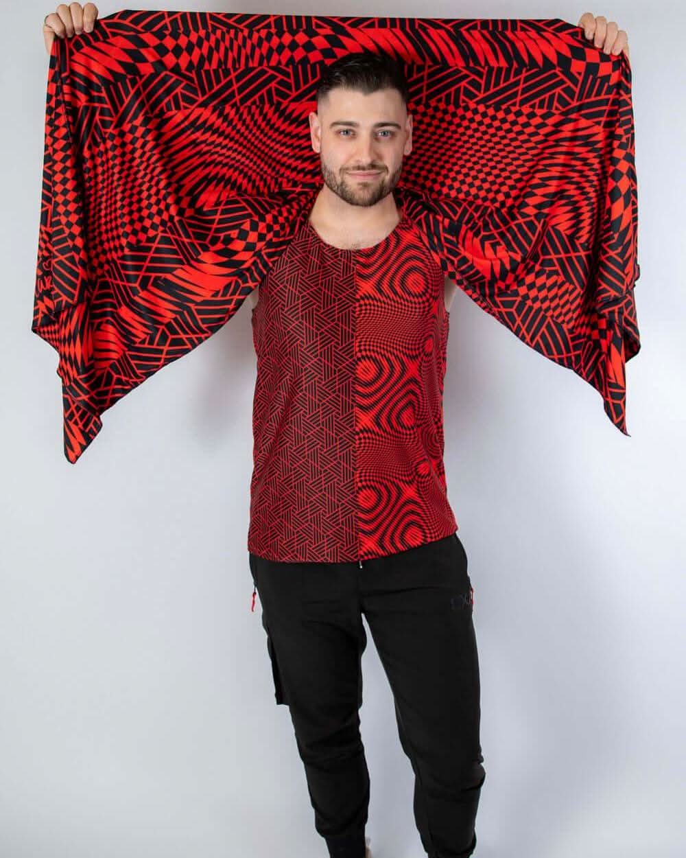Man wearing Amplitude Festival Scarf, showcasing red and black abstract patterns, perfect for rave outfits.