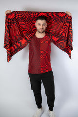 Man wearing Amplitude Festival Scarf, showcasing red and black abstract patterns, perfect for rave outfits.