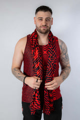 Male model wearing Amplitude Festival Scarf in red and black, perfect for rave outfits and festival fashion.