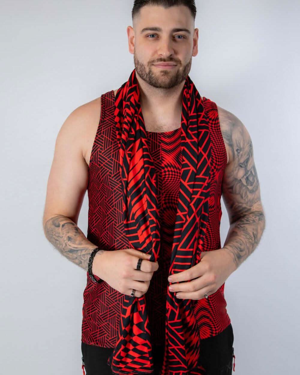 Male model wearing Amplitude Festival Scarf in red and black, perfect for rave outfits and festival fashion.