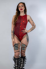 Amplitude High Neck Bodysuit in red and black, ideal for rave outfits, featuring leg straps and a unique design.