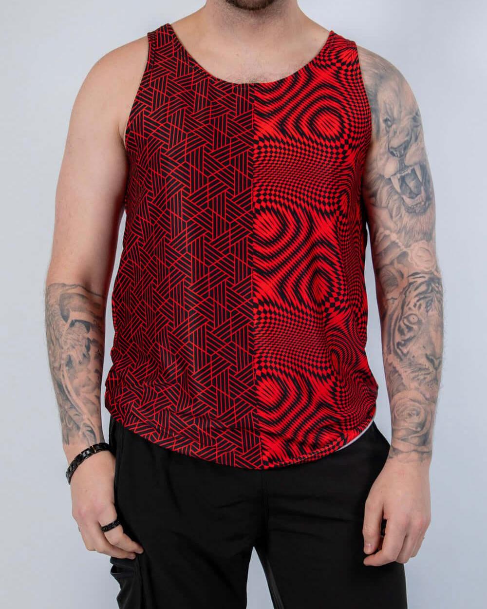 Model wearing Amplitude Men's Tank Top with abstract red and black pattern, perfect for rave outfits.