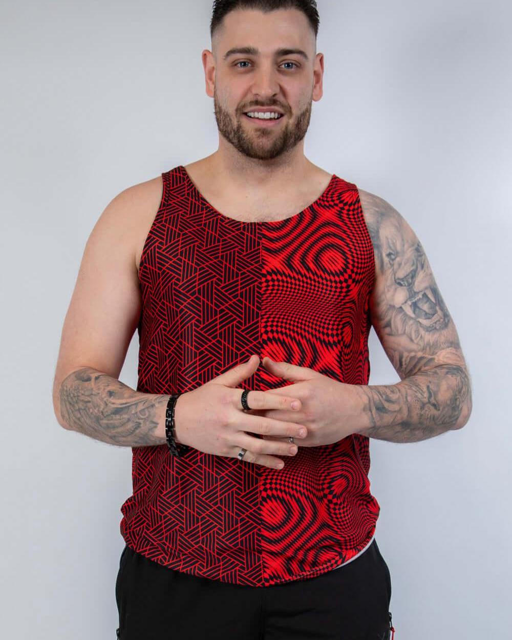 Stylish man wearing Amplitude Men's Tank Top in bold red, perfect for rave outfits and festival fashion.