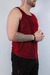 Man wearing Amplitude Men's Tank Top in bold red with abstract patterns, perfect for rave outfits.