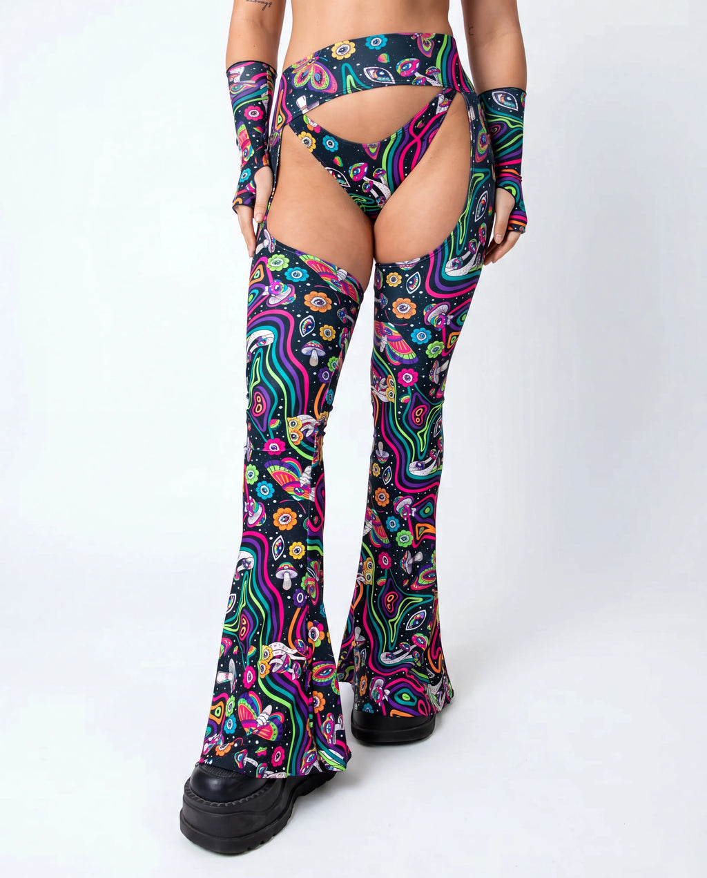 Awaken Bell Chaps from the back, featuring a vibrant psychedelic pattern with mushrooms and eyes, perfect for a rave festival. — cyc_3