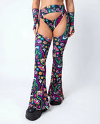 Awaken Bell Chaps from the back, featuring a vibrant psychedelic pattern with mushrooms and eyes, perfect for a rave festival. — cyc_3