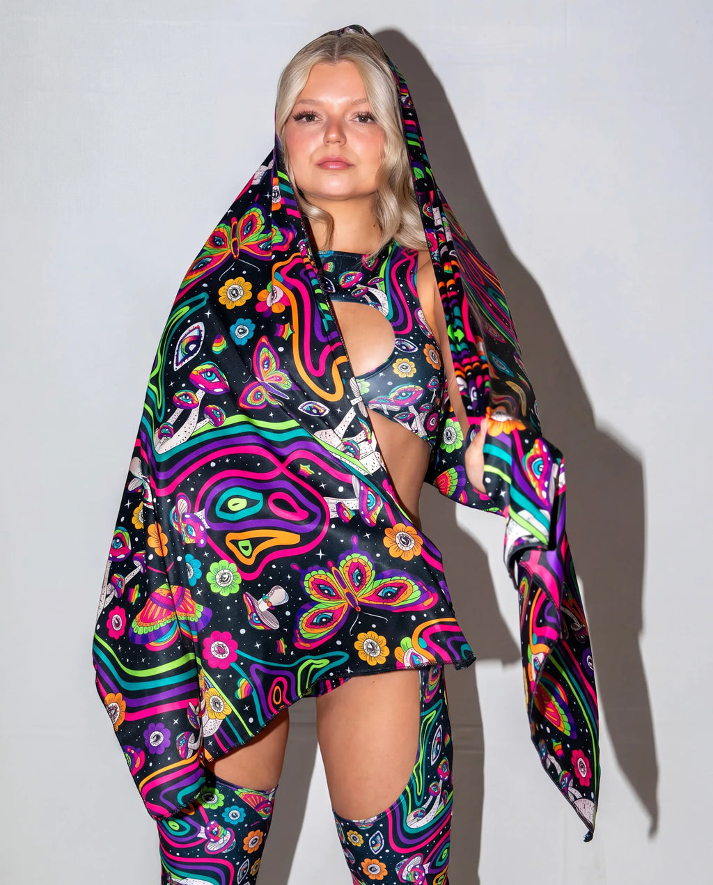 Awaken Festival Scarf in a psychedelic pattern, draped over a model's side, perfect for rave festival fashion. — cyc_5