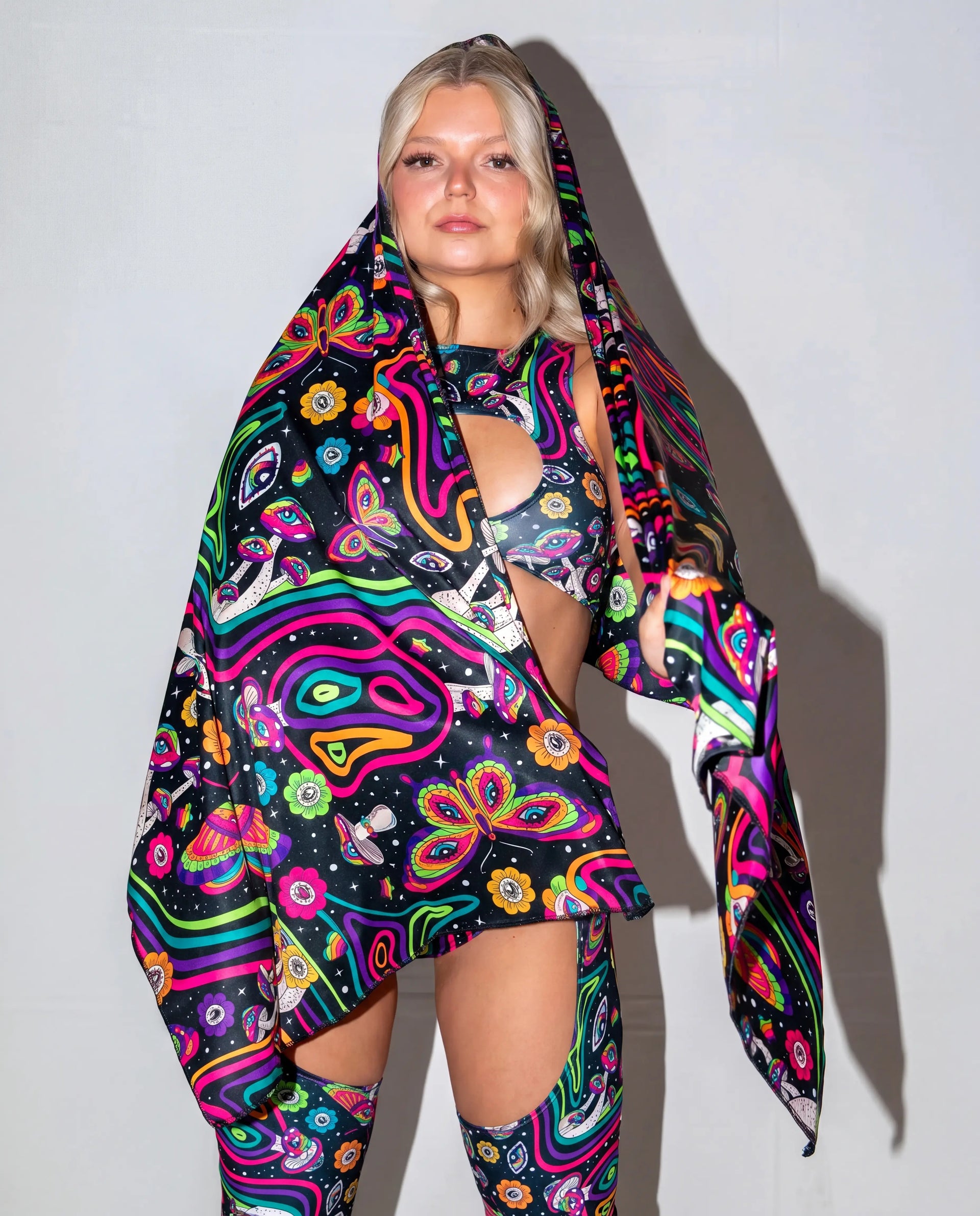 Awaken Festival Scarf in a psychedelic pattern, draped over a model's side, perfect for rave festival fashion. — cyc_5