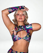 Awaken Gloves on a model, front view, showcasing the vibrant multi-color psychedelic pattern with cosmic eyes and florals, perfect for rave festivals. — cyc_2
