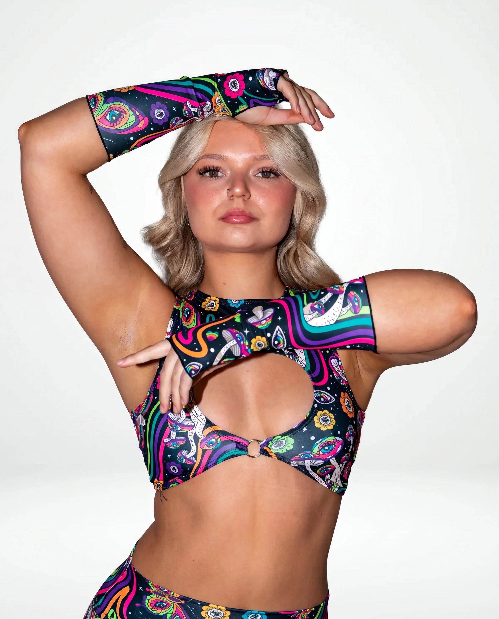 Awaken Gloves on a model, front view, showcasing the vibrant multi-color psychedelic pattern with cosmic eyes and florals, perfect for rave festivals. — cyc_2