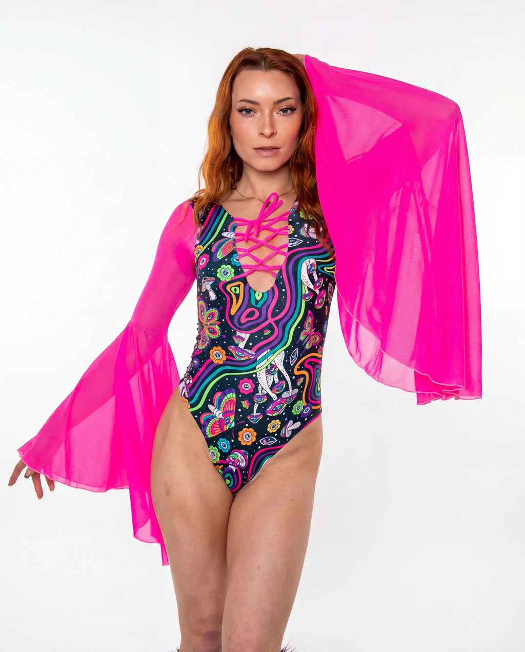 Awaken Goddess Bodysuit front view, featuring a colorful psychedelic pattern and sheer neon pink bell sleeves, perfect for a rave or festival. — cyc_3