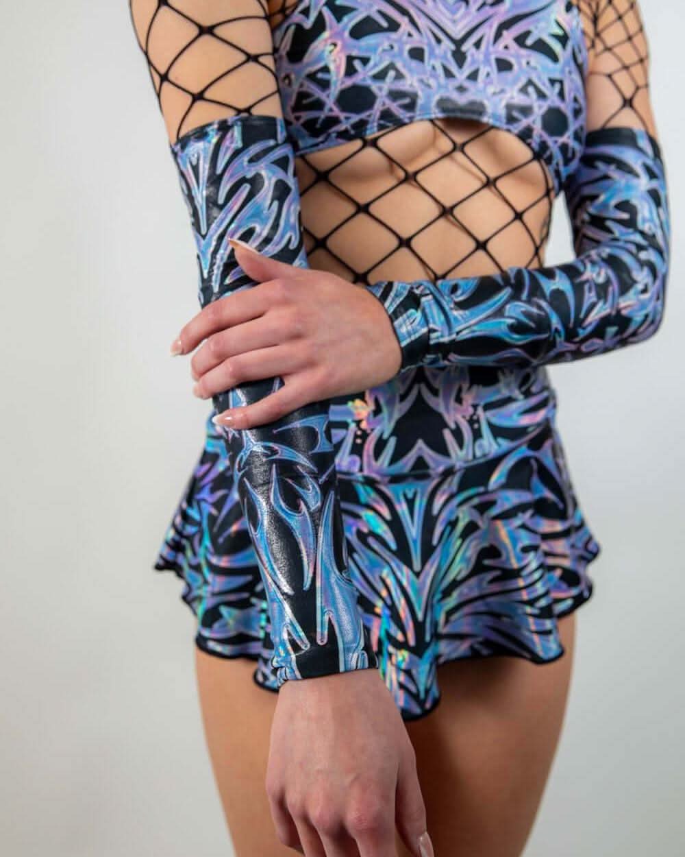 Chromium Arm Sleeves in a side pose, highlighting their stretchy fit and futuristic rave-ready pattern.