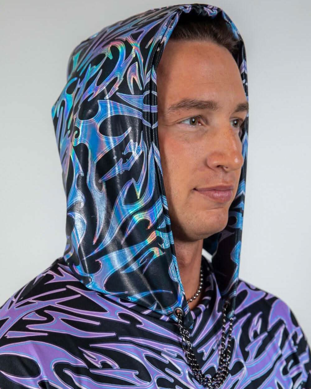 Model wearing the Chromium Assassin Hood, featuring a sleek cyber sigalism print and a futuristic hooded design.