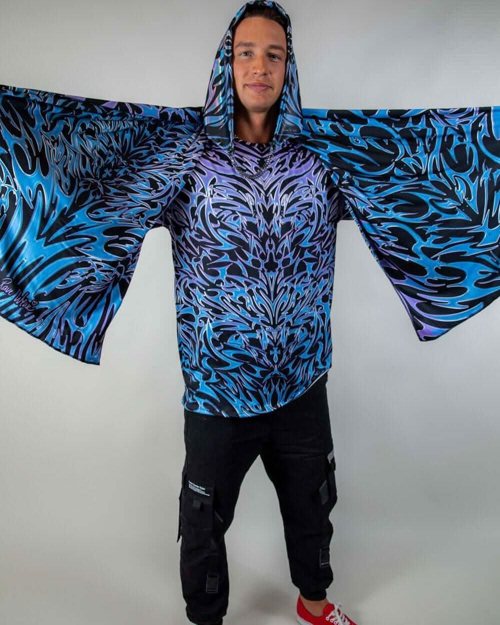 Model displaying the full length of the Chromium Festival Scarf, emphasizing its oversized fit and vibrant holographic pattern.