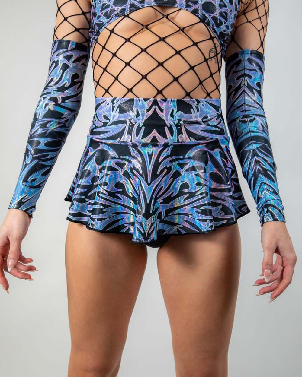 Model wearing the Chromium Micro Skater Skirt with a matching top, showcasing its high-waisted fit and festival-ready style.