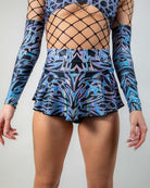 Model wearing the Chromium Micro Skater Skirt with a matching top, showcasing its high-waisted fit and festival-ready style.