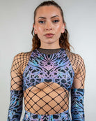Front view of the Chromium Teaser Top, highlighting its high-neck cut and sheer cyber mesh panel.