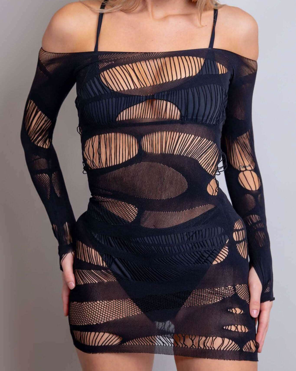 Dark Dimensions fishnet dress with an off-the-shoulder design, featuring a torn look for a fierce, ghoulish vibe.