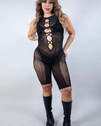 Black rhinestone fishnet rave bodysuit with cutout chest detail modeled front view for festival wear