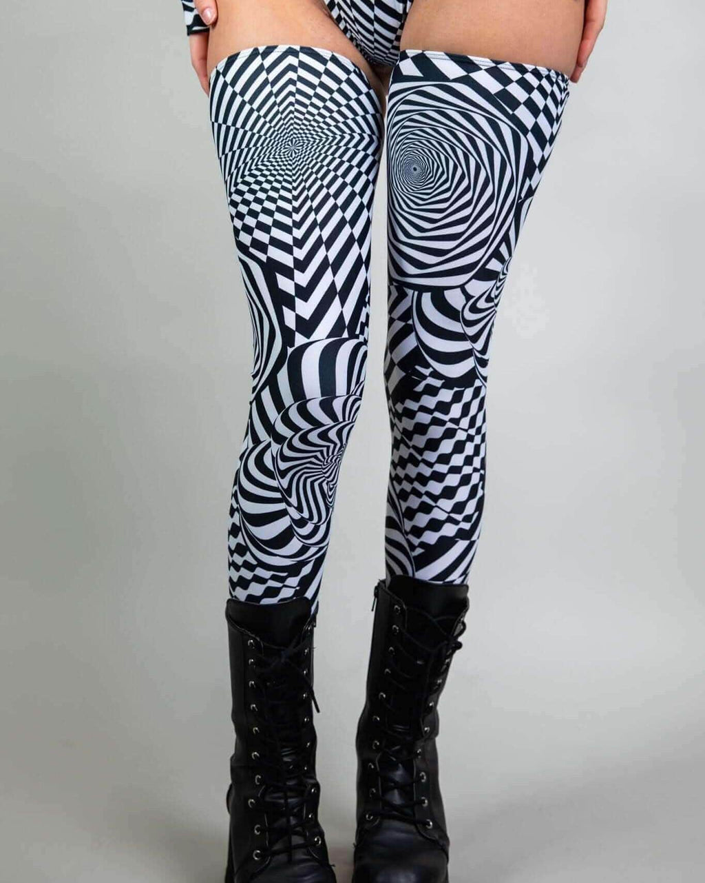 Distortion leg sleeves featuring an abstract optical design, perfect for rave outfits and stylish looks.