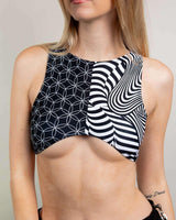Model wearing Duality Teaser Top, a stylish crop with unique patterns, perfect for rave outfits and made from recycled materials.