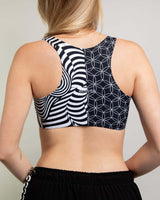Back view of Duality Teaser Top with contrasting black and white patterns, ideal for rave outfits.