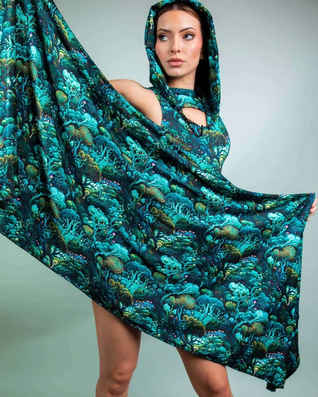 Model showcasing the Faewood Festival Scarf, a vibrant, hooded scarf with a whimsical tree design, perfect for rave outfits.