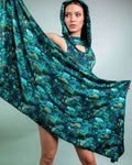 Model showcasing the Faewood Festival Scarf, a vibrant, hooded scarf with a whimsical tree design, perfect for rave outfits.