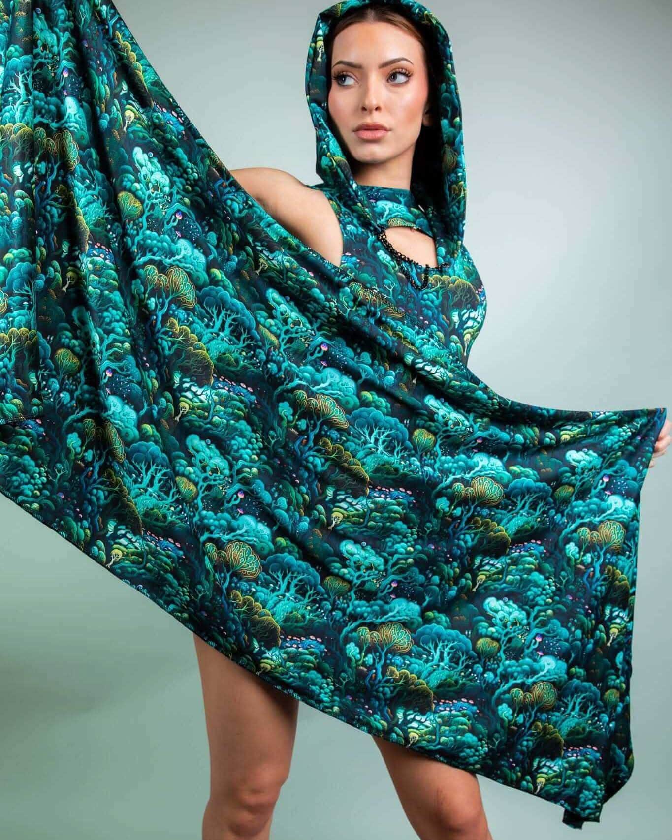 Model showcasing the Faewood Festival Scarf, a vibrant, hooded scarf with a whimsical tree design, perfect for rave outfits.