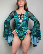 Teal Faewood rave bodysuit with bell sleeves and lace-up front detail on model