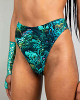 High-waisted thong featuring a vibrant forest pattern, perfect for rave outfits and eco-friendly fashion.
