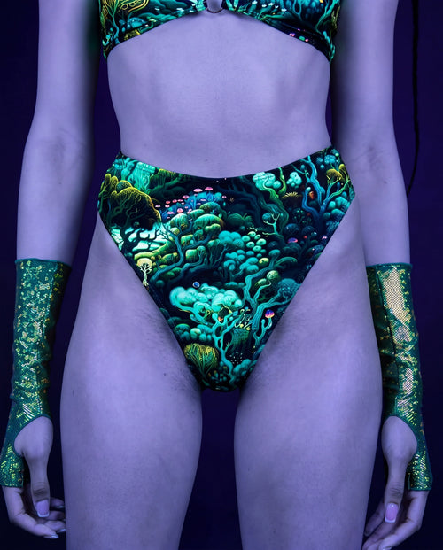 Faewood high waisted rave pants thong in teal forest print with matching festival outfit top — UV blacklight