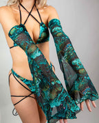 Blonde model wearing teal Faewood Metamorphosis rave arm sleeves with matching festival outfit front view