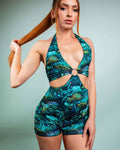 Model showcasing the Faewood Romper with an enchanted forest design, perfect for rave outfits and stylish events.