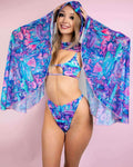 Model wearing vibrant fairycore mesh hooded bell sleeves over a colorful bikini, perfect for rave outfits and festivals.