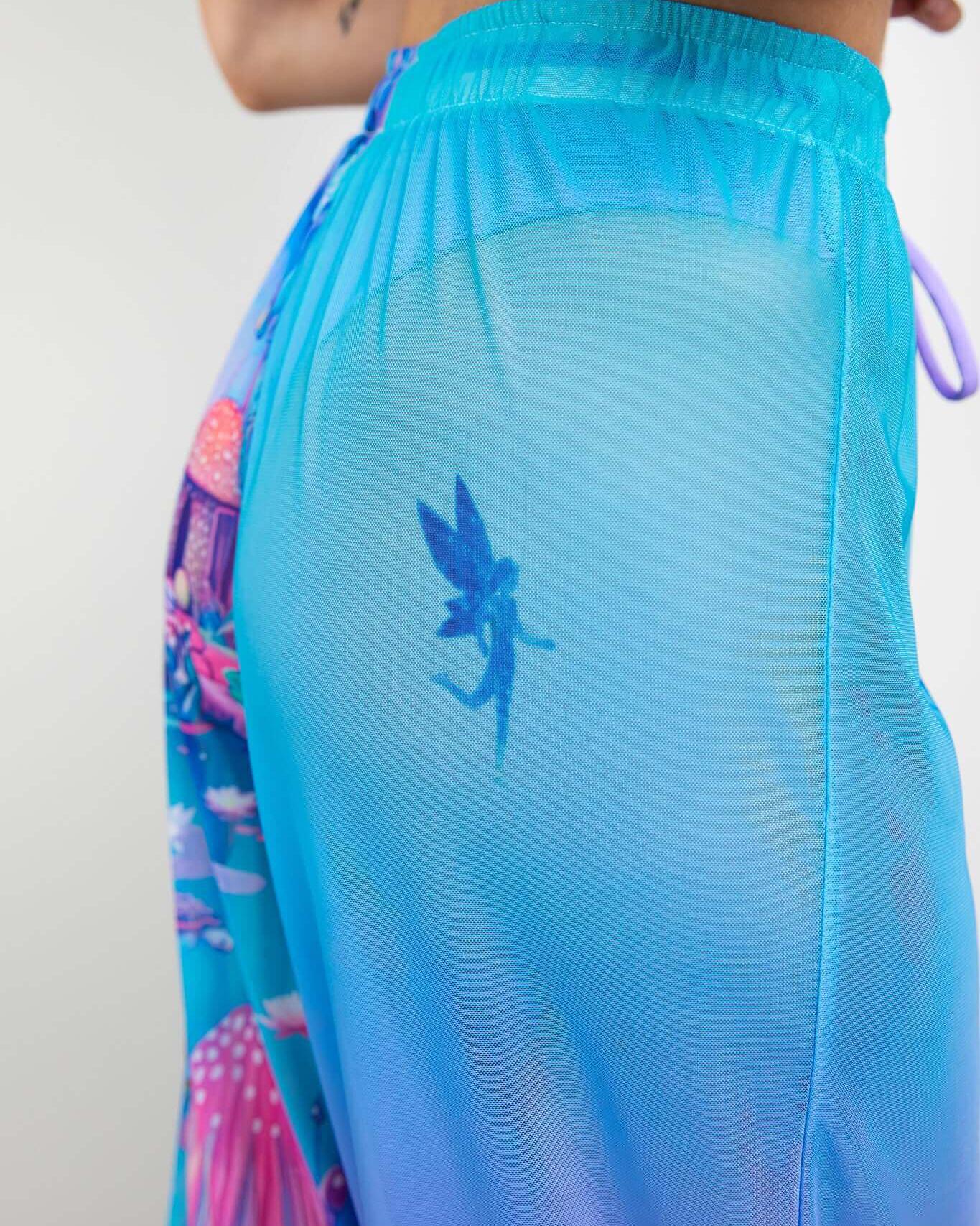Fairycore Mesh Lucy Pants featuring playful prints and a whimsical fairy design on a sheer fabric. Perfect for rave outfits.