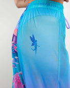 Fairycore Mesh Lucy Pants featuring playful prints and a whimsical fairy design on a sheer fabric. Perfect for rave outfits.
