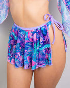 Vibrant fairycore mesh swirl skirt with tropical print, perfect for rave outfits and stylish layering options.