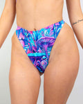 Fairycore Retro Thong Bottoms featuring a vibrant mushroom print in blue, pink, and purple, perfect for rave outfits.