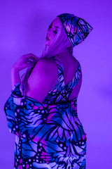 Model showcasing a holographic butterfly bandana in vibrant colors, perfect for rave outfits and festival clothing.