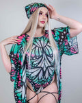 Model wearing a colorful butterfly print rave outfit and matching bandana, embodying festival style.