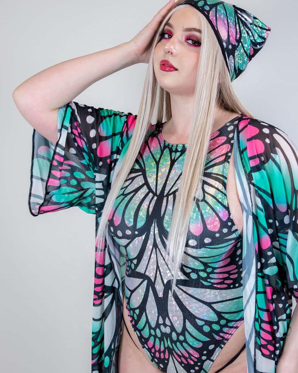 Stylish model wearing a holographic butterfly rave outfit and matching headwear, perfect for festival clothing.