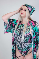 Stylish model wearing a holographic butterfly rave outfit and matching headwear, perfect for festival clothing.