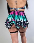 Model wearing a colorful Flutter Fairy Skirt with butterfly design, perfect for rave outfits and whimsical occasions.
