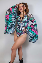 Model wearing the Flutter Goddess Bodysuit with butterfly pattern and flowy bell sleeves, perfect for rave outfits.