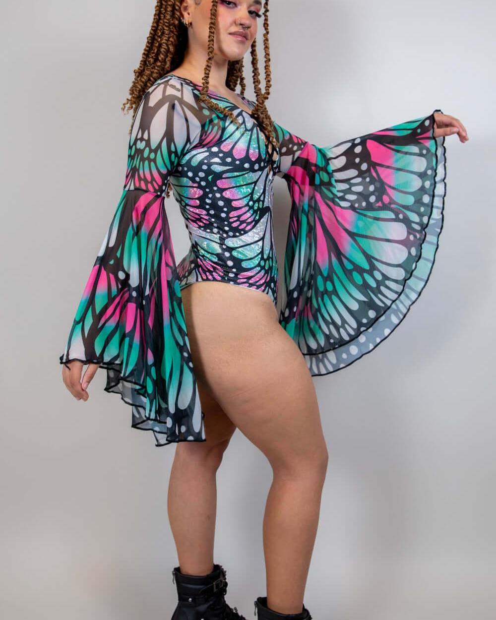 Model wearing Flutter Goddess Bodysuit with butterfly print and bell sleeves, showcasing a stunning rave outfit.