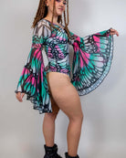 Model wearing Flutter Goddess Bodysuit with butterfly print and bell sleeves, showcasing a stunning rave outfit.